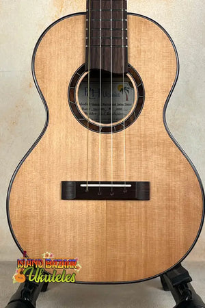 Natural wood Nebula Tenor Ukulele featuring Western Red Cedar and Claro Walnut craftsmanship