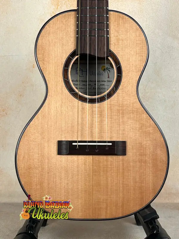 Natural wood Nebula Tenor Ukulele featuring Western Red Cedar and Claro Walnut craftsmanship