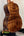Acoustic guitar back of Kanile’a Honus Tenor Ukulele in premium curly koa wood