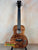 Beautiful Kanile’a Honus Tenor Ukulele featuring premium curly koa and floral inlays