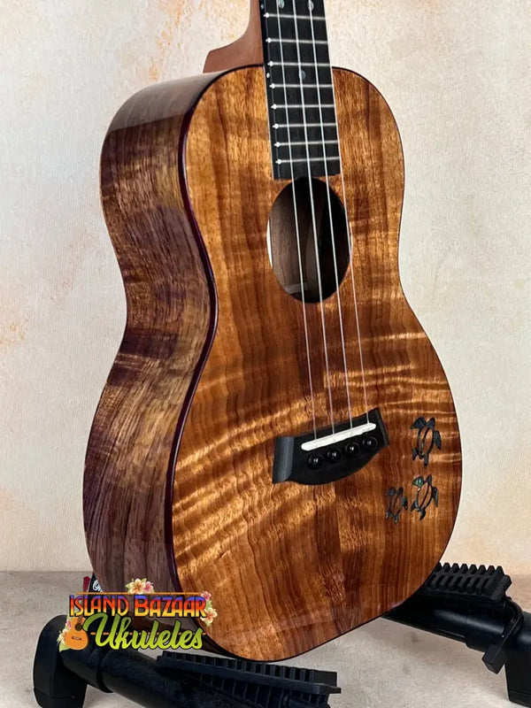 Beautiful premium curly koa Kanile’a Honus Tenor Ukulele with dark grain patterns