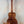 Acoustic guitar with rich brown koa wood grain patterning in Kanile’a Honus Tenor Ukulele