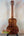 Acoustic guitar with rich brown koa wood grain patterning in Kanile’a Honus Tenor Ukulele