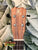 Wooden ukulele headstock with KC logo and tuning pegs from Kanile’a K-1 Soprano in Premium Hawaiian Koa