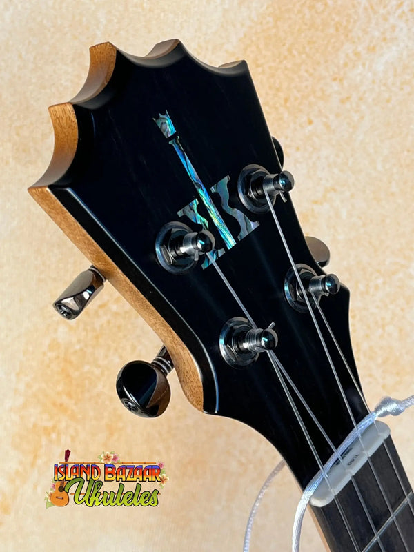 Guitar headstock with black tuning pegs on KoAloha Royal Pikake KTM-10RP Ukulele