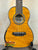 Honey-colored Ohana CK-150SMP Spalted Mango Concert Ukulele with Abalone Rosette design