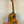 Ohana CK-150SMP Spalted Mango Concert Ukulele with Abalone Rosette on a stand