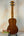 Ohana CK-35G Solid Mahogany Concert Ukulele showcasing a beautiful mahogany body