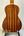 Ohana CK-35G Solid Mahogany Concert Ukulele with vertical grain on a stand