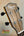 Ohana CK-35G headstock with black tuning pegs and rich wooden grain finish