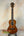 Wooden Ohana CK-35G Solid Mahogany Concert Ukulele with dark brown finish and black tuning pegs