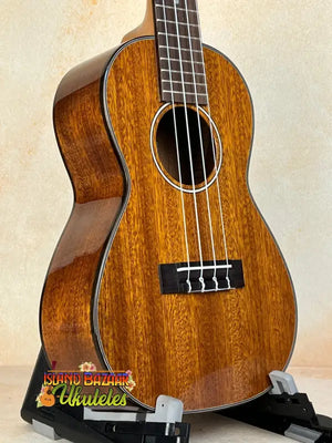 Beautiful Ohana CK-35G Solid Mahogany Concert Ukulele with four strings and dark finish