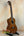 Wooden Ohana CK-35G Solid Mahogany Concert Ukulele on a black stand at Island Bazaar Ukes