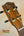Ohana CK-370G Concert Ukulele headstock with gold tuning pegs and decorative binding