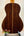 Acoustic guitar featuring rich brown rosewood back, highlighting Ohana CK-50G design