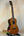 Ohana CK-50G Solid Cedar & Rosewood Concert Ukulele with natural finish and four strings