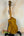 Golden Ohana CK-50WG Concert Ukulele in Cedar & Willow on a black stand