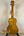 Golden Ohana CK-50WG Concert Ukulele with woodgrain pattern on black stand