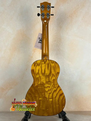 Golden Ohana CK-50WG Concert Ukulele with woodgrain pattern on black stand