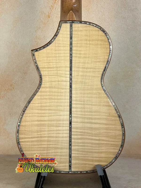 Back view of Ohana CK-75CG Concert Ukulele showcasing flamed maple wood and decorative binding