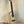 Light-colored wooden Ohana CK-75CG Concert Ukulele on a black stand, limited edition