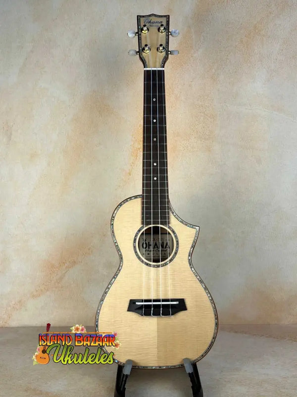 Natural wood Ohana CK-75CG Concert Ukulele with decorative binding and cutaway design