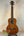 Ohana TK-35G Solid Mahogany Tenor Ukulele with four strings and dark fretboard