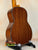 Ohana TK-35G Solid Mahogany Tenor Ukulele resting on a black stand for display