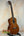 Ohana TK-35G Solid Mahogany Tenor Ukulele with four strings and a rich mahogany finish