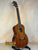 Ohana TK-35G Solid Mahogany Tenor Ukulele with four strings and a rich mahogany finish