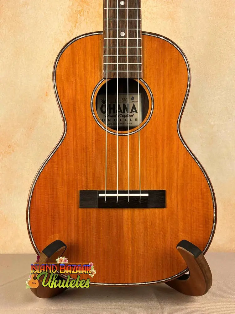 Wooden Ohana TK-50G solid cedar tenor ukulele with natural finish and decorative rosette