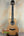Natural wood Ohana TK-50ME Solid Cedar tenor ukulele with black tuning pegs and rosette
