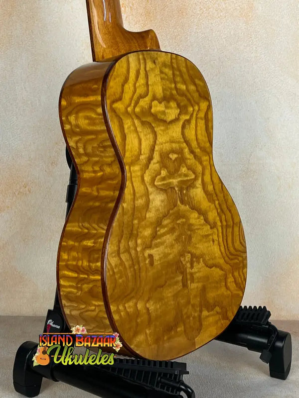 Acoustic guitar featuring quilted maple wood grain on the Ohana TK-50WG Tenor Ukulele