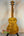 Golden quilted maple Ohana TK-50WG Tenor Ukulele with glossy finish and solid cedar body
