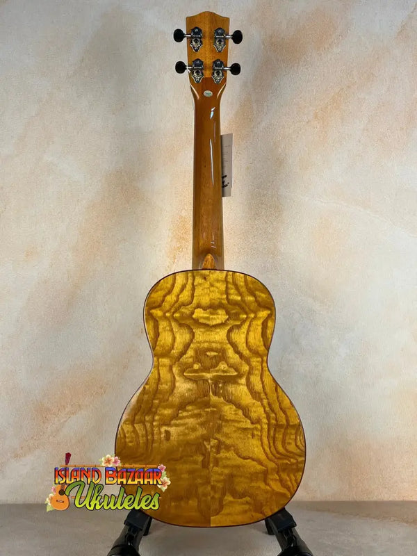 Golden quilted maple Ohana TK-50WG Tenor Ukulele with glossy finish and solid cedar body