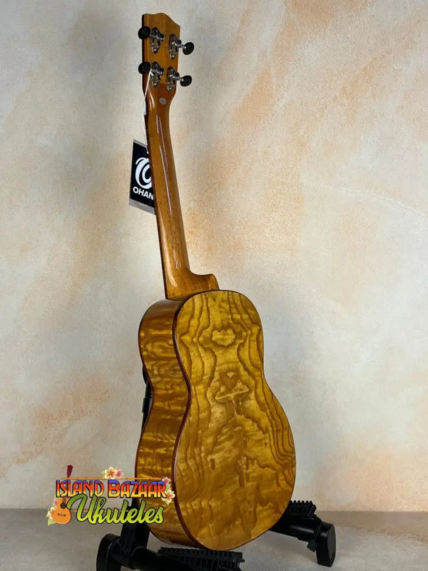 Wooden ukulele showcasing curly maple grain, Ohana TK-50WG Tenor with solid cedar & willow