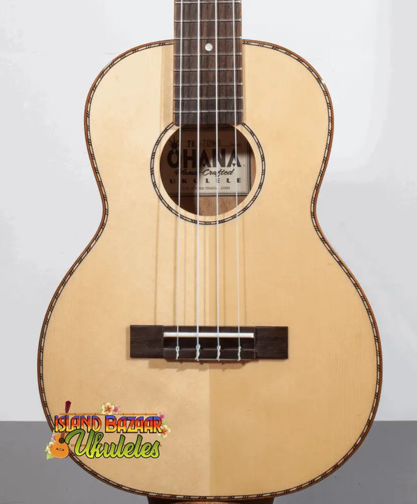 Natural wood Ohana TK-70WG Spruce Top Tenor Ukulele with decorative binding