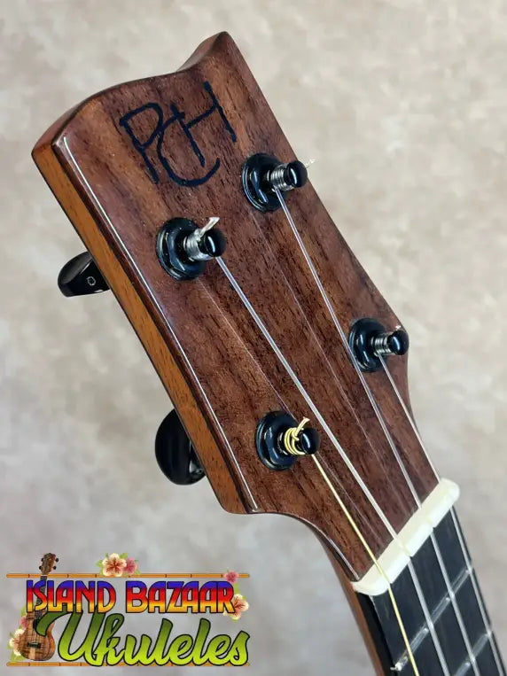 PCH custom tenor ukulele headstock with stamped logo