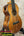 Flamed koa wood acoustic-electric ukulele with abalone purfling and soundhole rosette