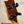 Burled wood ukulele headstock with black tuning pegs on PCH Sunshine Tenor Ukulele featuring solid Hawaiian Koa