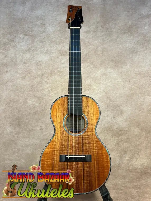 Acoustic PCH Sunshine Tenor Ukulele with curly koa wood body and ebony fretboard