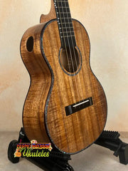 Brown wooden tenor ukulele made of solid Hawaiian Koa by Phil Henderson