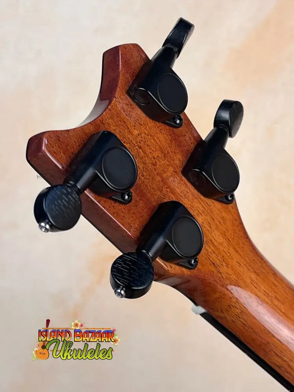 Guitar headstock with black tuning pegs on wooden neck of Pepe Romero TTM-23032