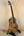 Wooden Phil Henderson Custom PCH Tenor Ukulele on stand in solid mango wood