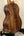 Wooden acoustic guitar featuring rich brown koa wood grain in Phil Henderson Ukuleles Chocolate Thunder Solid Koa Tenor