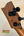 Guitar headstock with black tuning pegs on Phil Henderson Ukuleles Chocolate Thunder Solid Koa Tenor