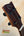 Dark wooden guitar headstock with black tuning pegs for Phil Henderson Ukuleles Chocolate Thunder Solid Koa Tenor