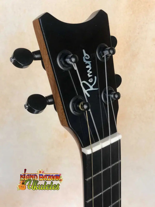 Black ukulele headstock with Kmise branding for Romero Creations Concert Ukulele