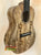 Wooden Romero Creations Concert Ukulele with spalted grain patterns and case