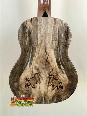 Wooden acoustic guitar back panel featuring natural grain patterns in Romero Creations Grand Tenor